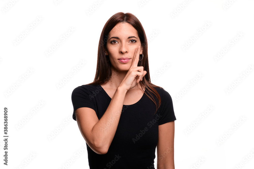 Isolated in white background brunette woman saying mother in spanish sign language Isolated in white background brunette woman saying mother in spanish sign language