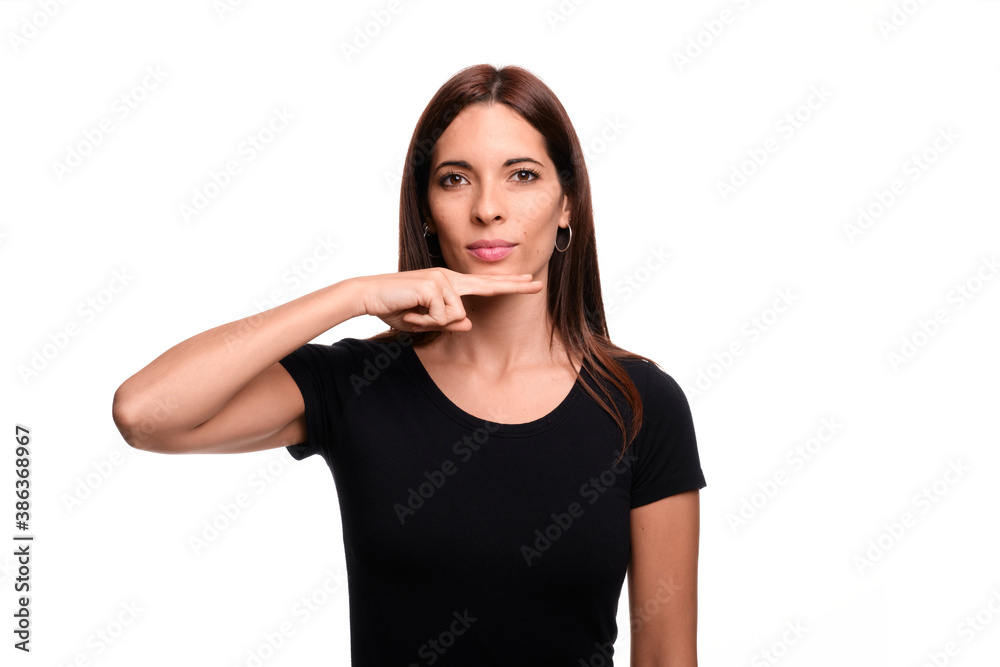 Isolated in white background brunette woman saying father in spanish sign language Isolated in white background brunette woman saying father in spanish sign language