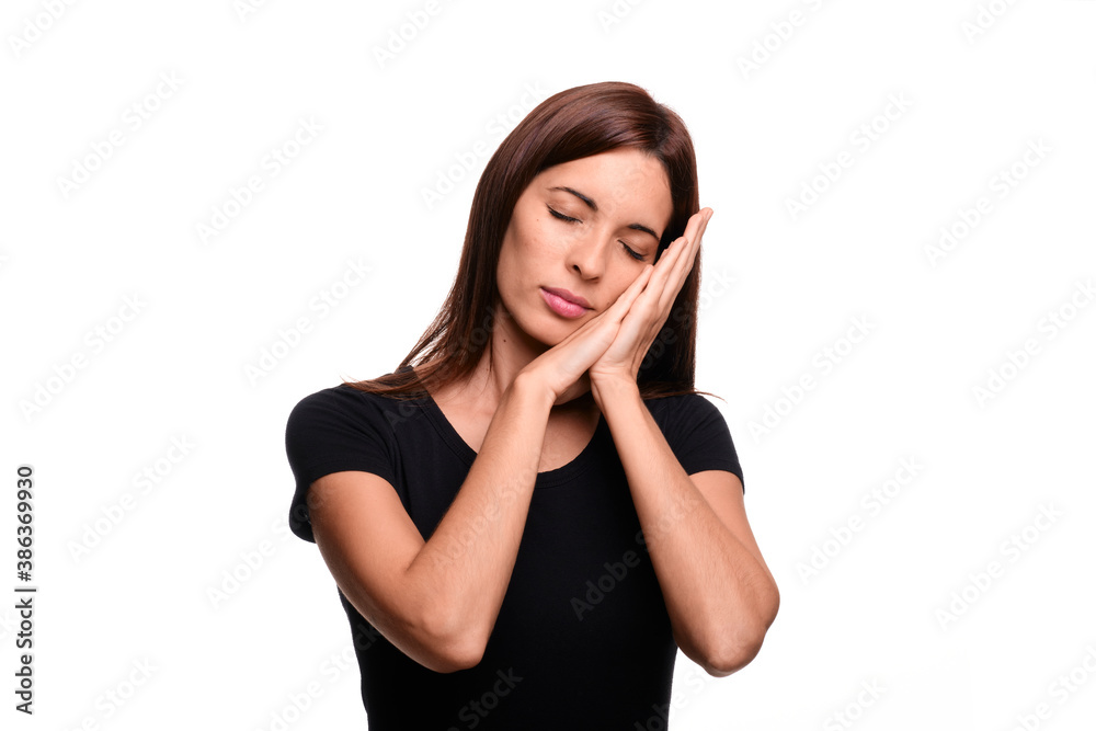 Isolated in white background brunette woman saying sleep in spanish sign language Isolated in white background brunette woman saying sleep in spanish sign language