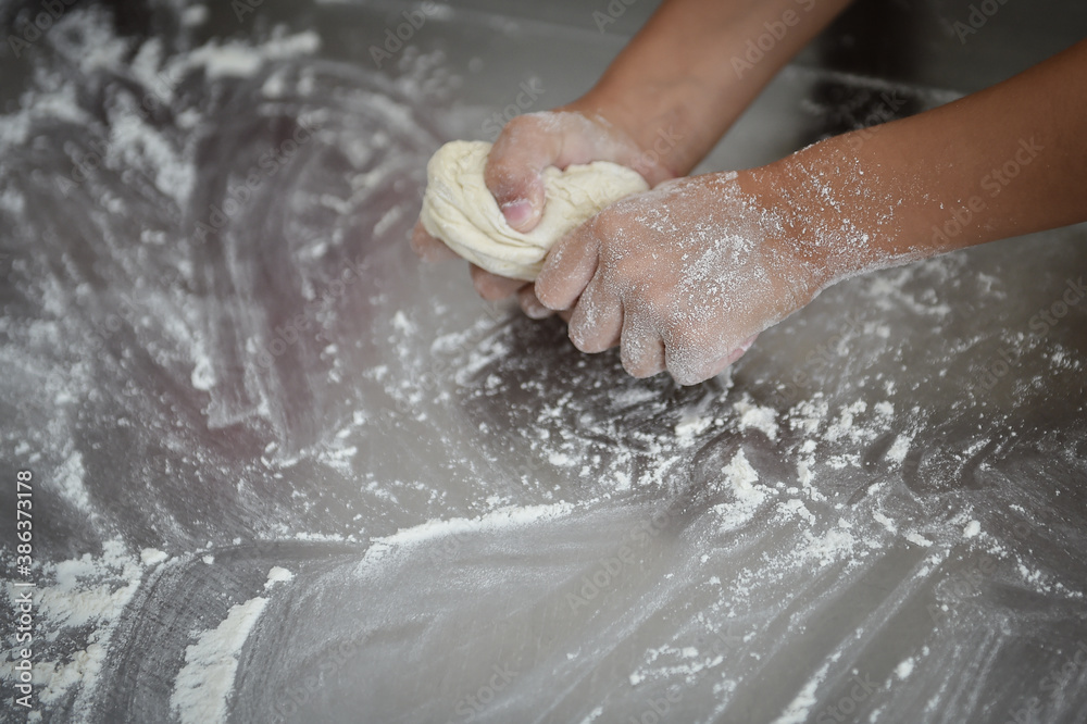 Kids playing with dough making homemade pastry products Kids playing with dough making homemade pastry products