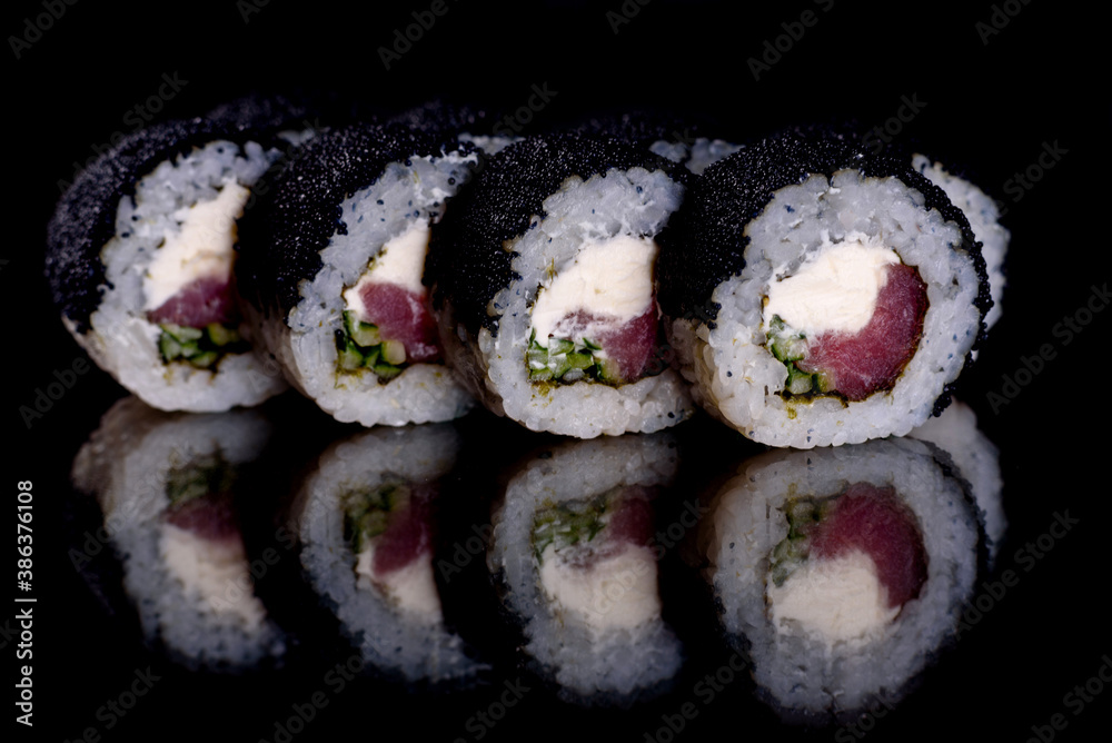 Fresh delicious beautiful sushi rolls on a dark background Fresh delicious beautiful sushi rolls on a dark background