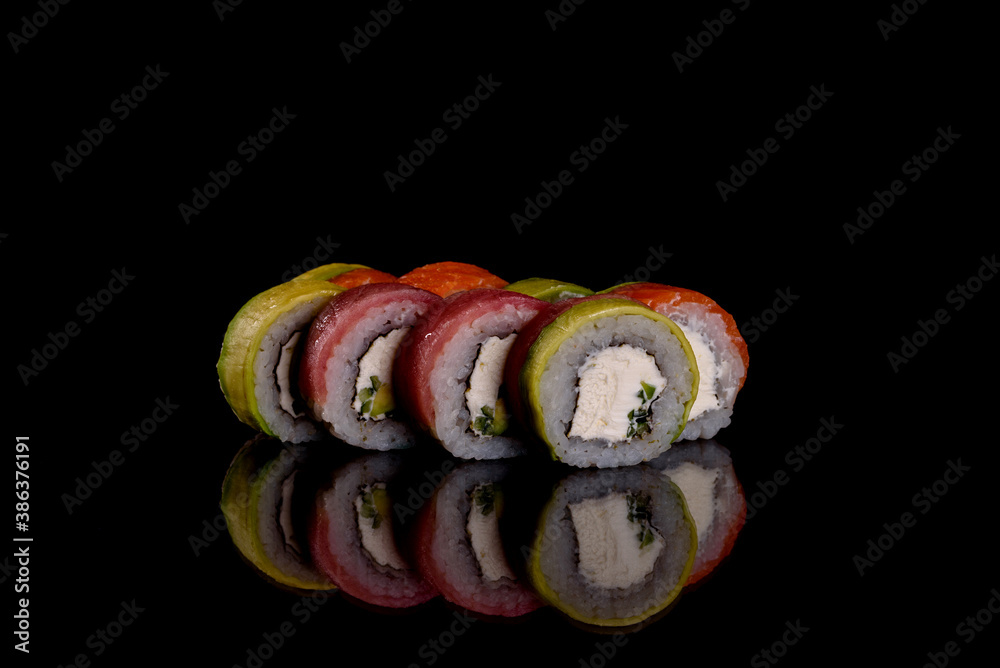 Fresh delicious beautiful sushi rolls on a dark background Fresh delicious beautiful sushi rolls on a dark background