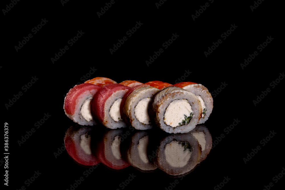 Fresh delicious beautiful sushi rolls on a dark background Fresh delicious beautiful sushi rolls on a dark background