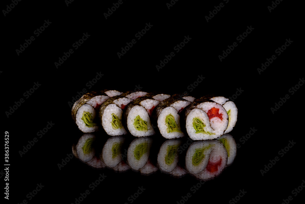 Fresh delicious beautiful sushi rolls on a dark background Fresh delicious beautiful sushi rolls on a dark background