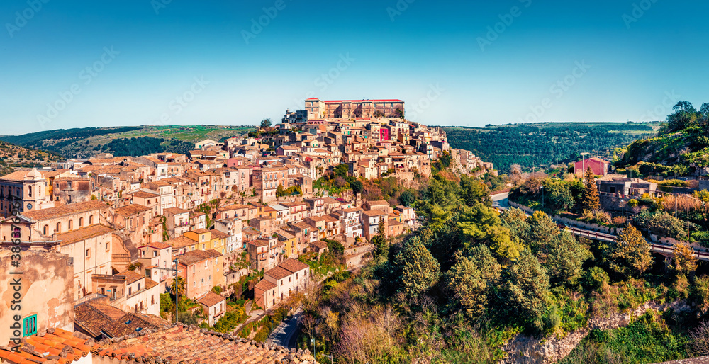 Panoramic spring view of Ragusa town with Palazzo Cosentini and Duomo di San Giorgio church on background. Picturesque morning scene of Sicily, Italy, Europe. Traveling concept background.