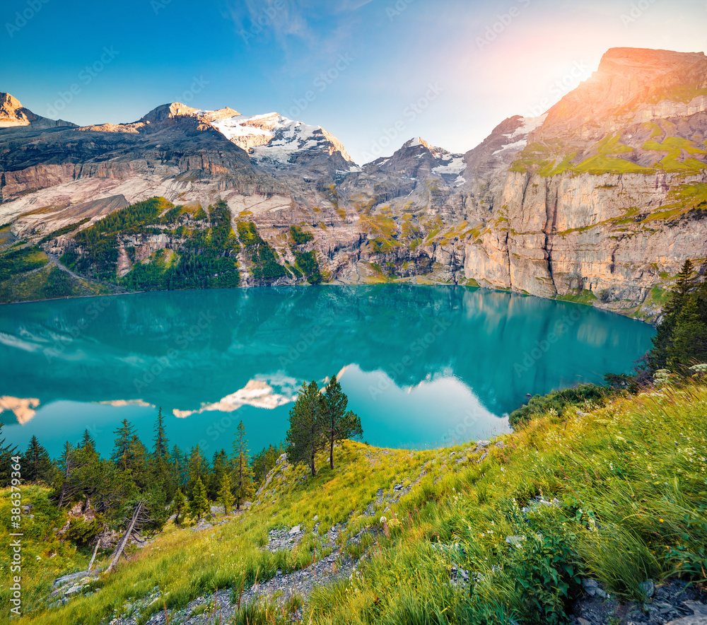 Fabulous summer view of unique Oeschinensee Lake. Colorful morning scene in the Swiss Alps with Bluemlisalp mountain, Kandersteg village location, Switzerland, Europe.