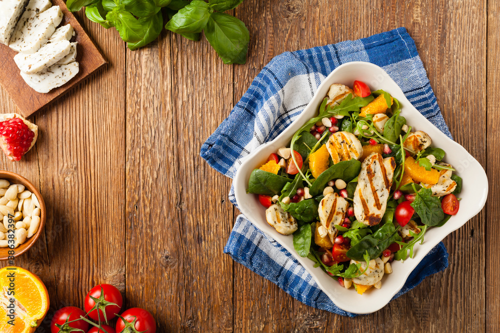 Traditional Greek salad with grilled Halloumi cheese with basil. Top view. Flat lay. Traditional Greek salad with grilled Halloumi cheese with basil. Top view. Flat lay.