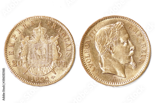 Pièce Napoléon 3 en or sur fond blanc  photo