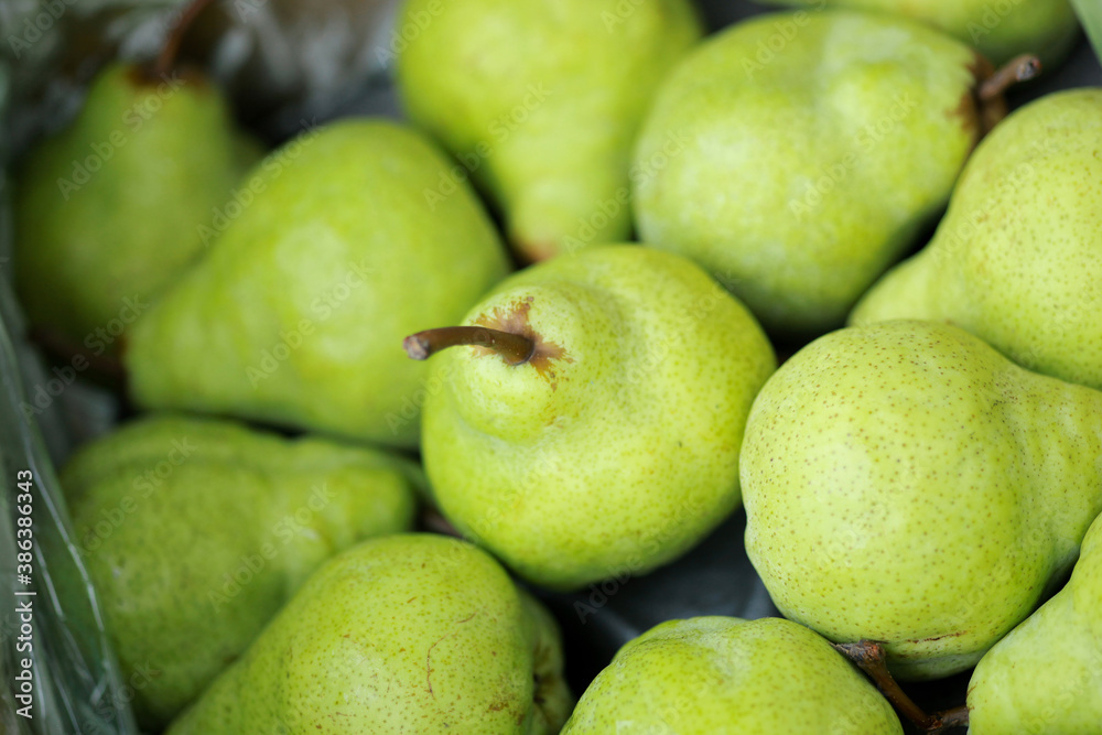 Blurry photo of Fresh green pears texture and background