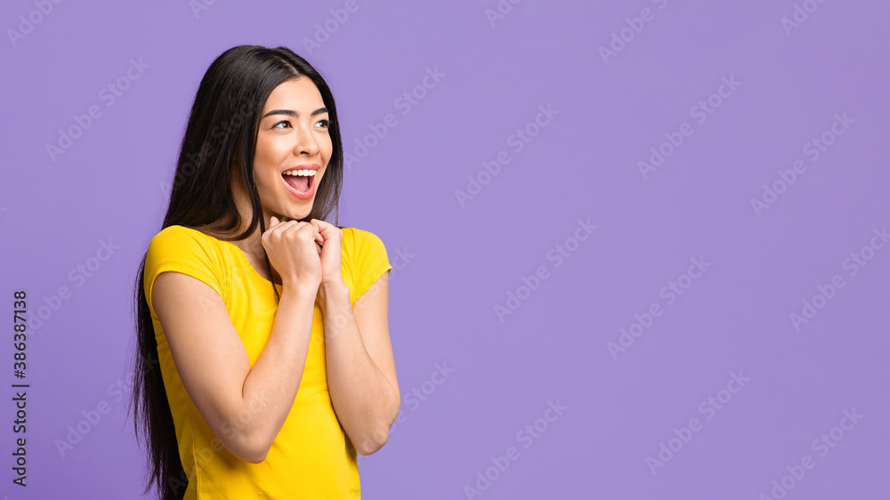 Excited Asian Female Looking At Copy Space And Exclaiming With Excitement Excited Asian Female Looking At Copy Space And Exclaiming With Excitement