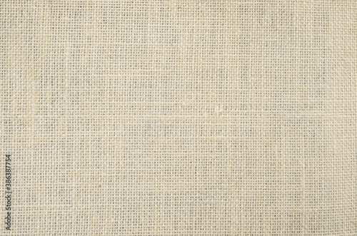 Light brown weaving canvas fabric texture background.
