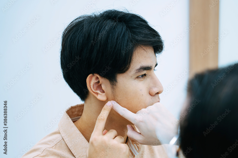 Beautician checking man face for facial treatment in beauty clinic. Beautician checking man face for facial treatment in beauty clinic.