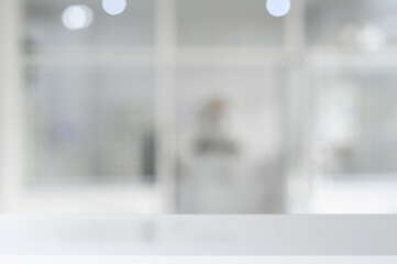 White table top on blurred contemporary office interior white background. For display your products