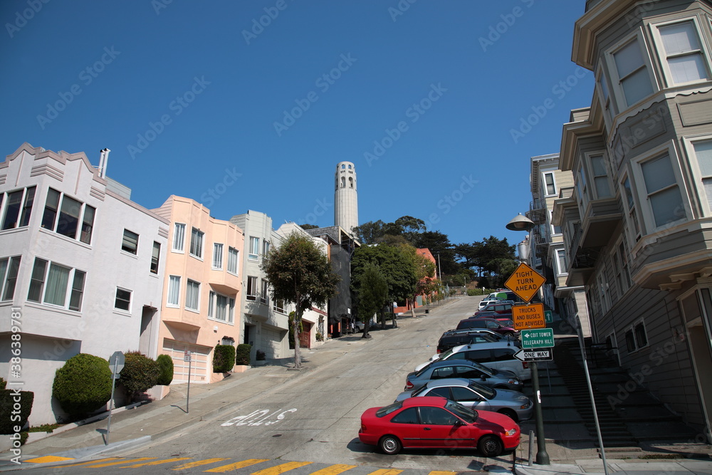 View of San Francisco street view with house, apartment and Coit Tower in San Francisco, California, USA