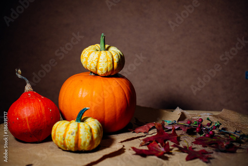 Bright pumpkins on the table on craft paper