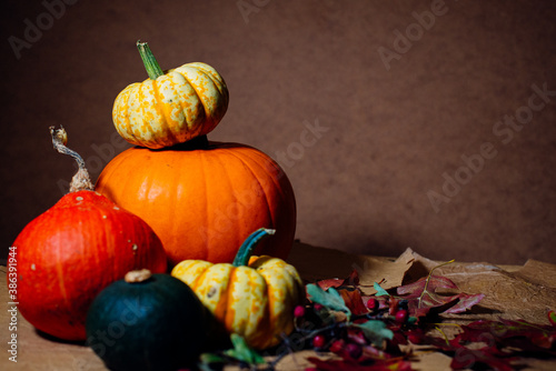 Bright pumpkins on the table on craft paper