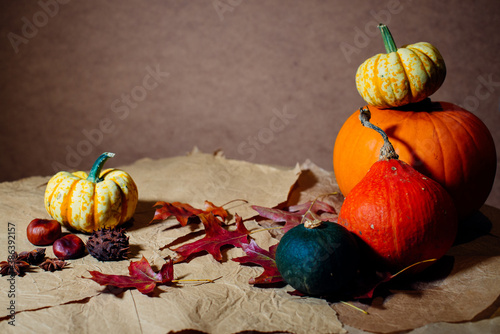 Bright pumpkins on the table on craft paper