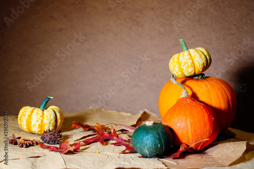 Bright pumpkins on the table on craft paper