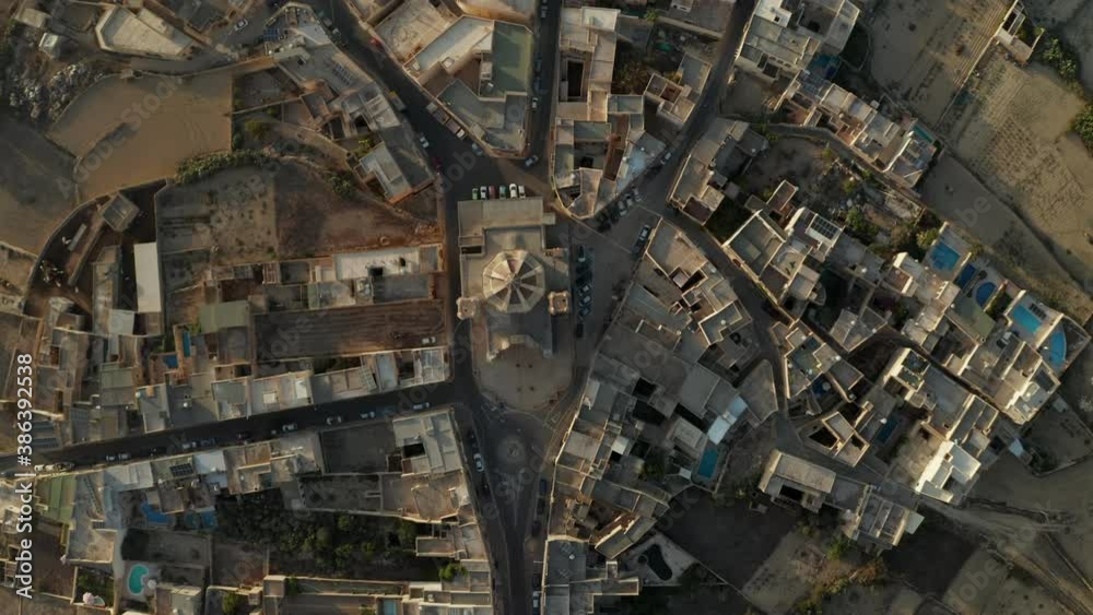 Church in Center of Gozo, Malta Island Small Township in Brown and Beige Sand Color, Aerial Birds Eye Overhead Top Down View Church in Center of Gozo, Malta Island Small Township in Brown and Beige Sand Color, Aerial Birds Eye Overhead Top Down View