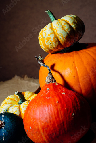 Bright pumpkins on the table on craft paper