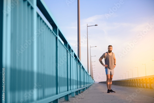 Fit male training outdoors during a beautiful morning