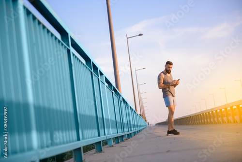 Fit male making a selfie during his outdoor workout
