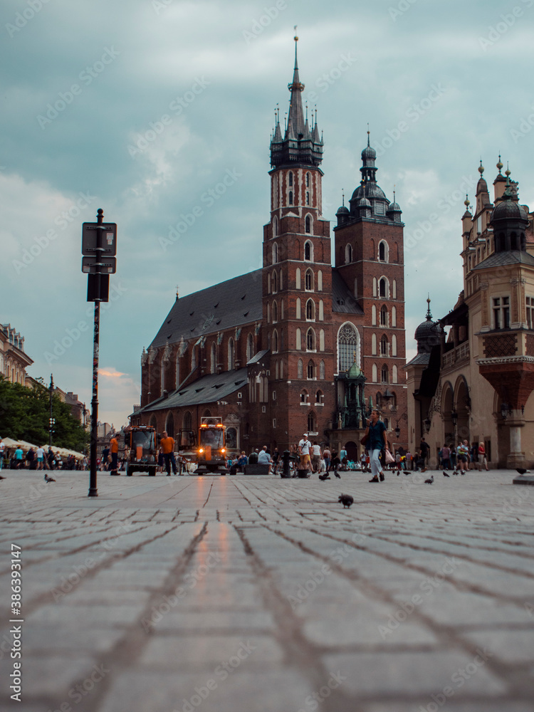 Obraz premium Old city square with church on a cloudy day
