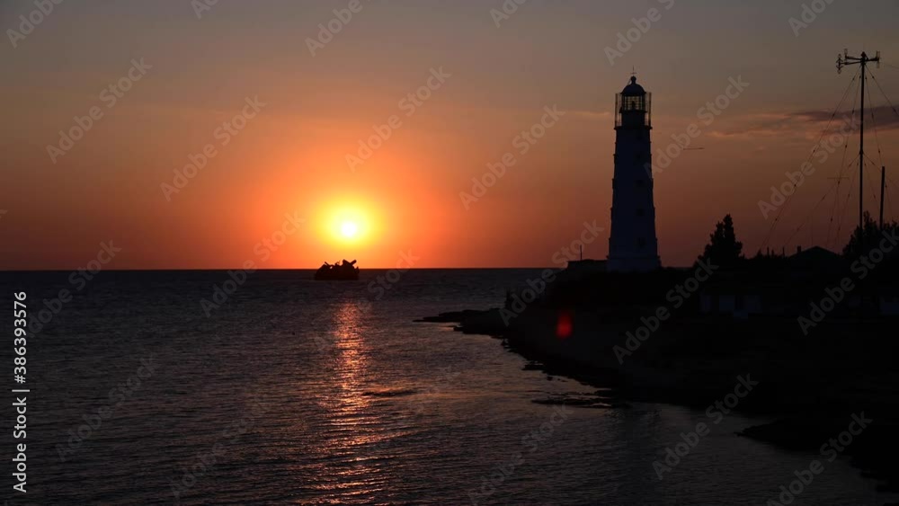 Marine timelapse silhouette of the coast and sea lighthouse with the movement of clouds in the evening 4k Marine timelapse silhouette of the coast and sea lighthouse with the movement of clouds in the evening 4k