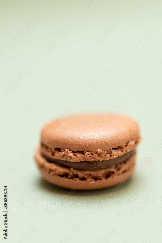 Colored tasty macaroons over a green background. Colored tasty macaroons over a green background.