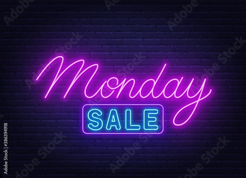 Monday Sale neon sign on brick wall background .