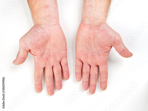 male hands palm brushes on white background