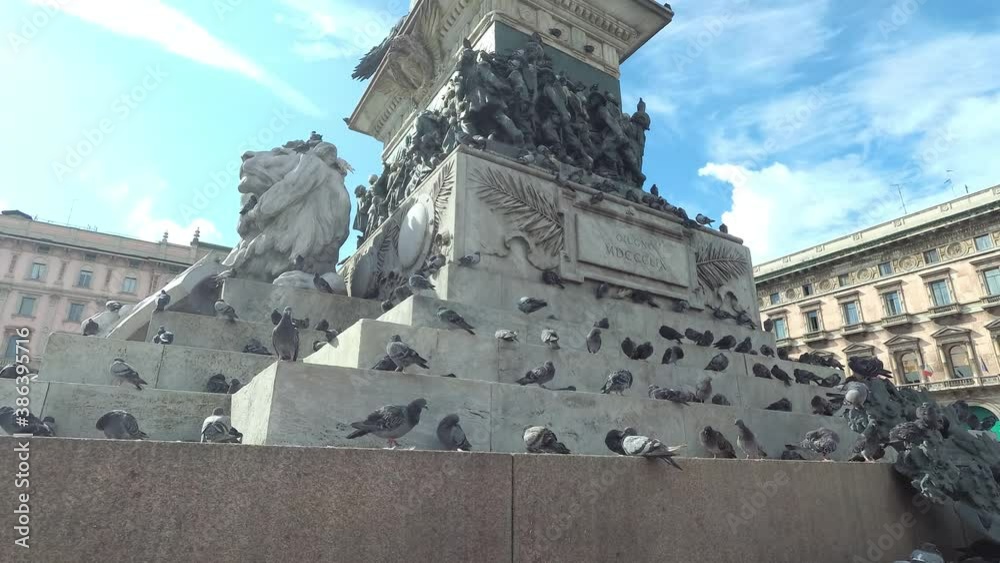 Pigeons sitting on the Vittorio Emanuele II statue in Milan Italy Pigeons sitting on the Vittorio Emanuele II statue in Milan Italy