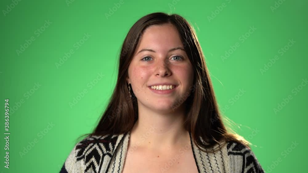 Portrait happy young woman talking video calling on chatting laughing enjoy online conversation looking at webcam, green screen, girl blogger influencer speaking to camera recording vlog for channel Portrait happy young woman talking video calling on chatting laughing enjoy online conversation looking at webcam, green screen, girl blogger influencer speaking to camera recording vlog for channel