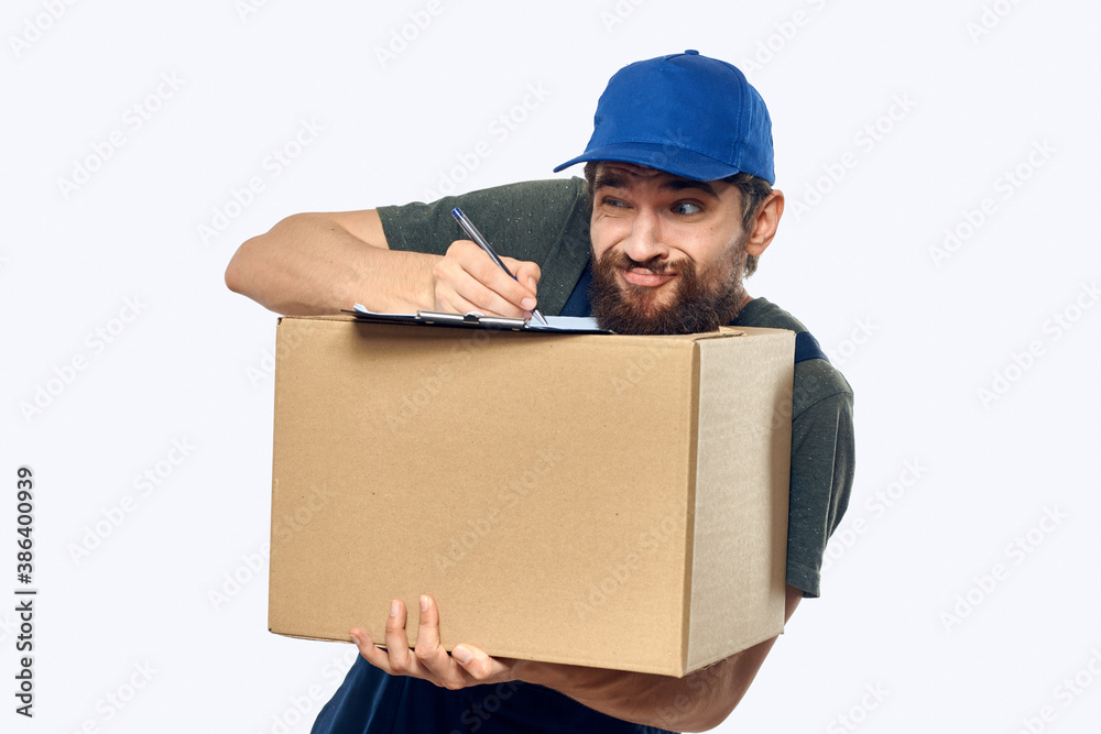 Working male courier with box in hand documents delivery service light background Working male courier with box in hand documents delivery service light background