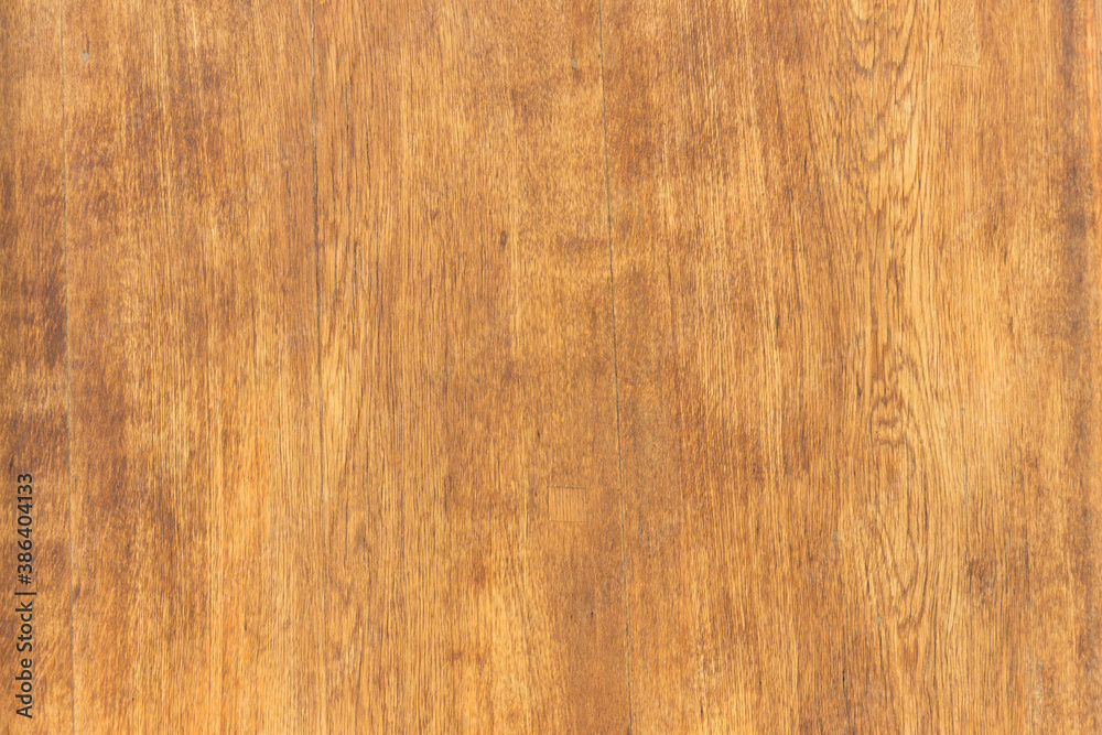 Fototapeta premium Texture of lacquered wood planks painted in brown.
