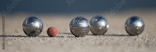 Metallic petanque four balls and a small wood jack