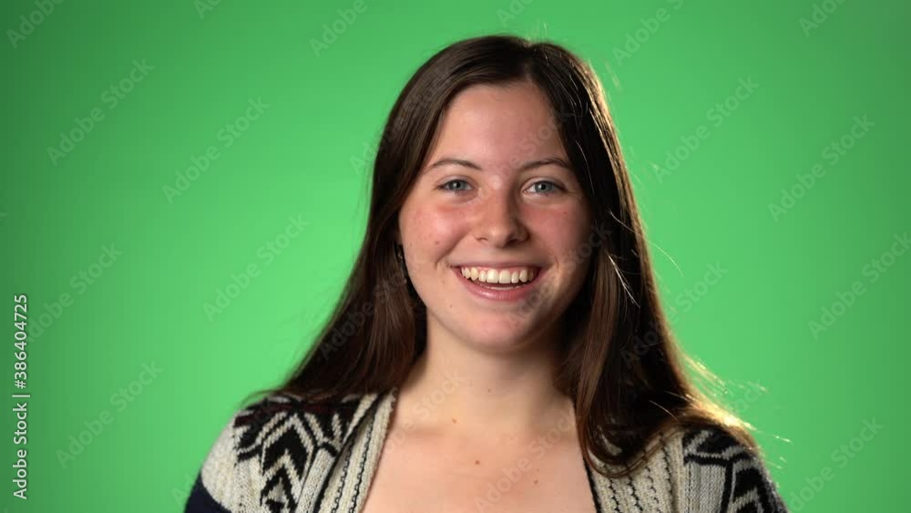 Portrait happy young woman talking video calling on chatting laughing enjoy online conversation looking at webcam, green screen, girl blogger influencer speaking to camera recording vlog for channel Portrait happy young woman talking video calling on chatting laughing enjoy online conversation looking at webcam, green screen, girl blogger influencer speaking to camera recording vlog for channel