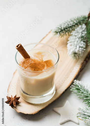 Eggnog cocktail, creamy christmas drink with spice cinnnamon