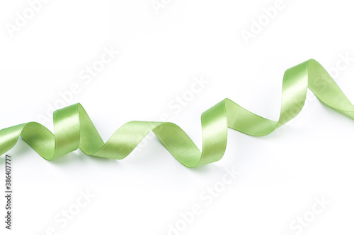 green satin curly ribbon isolated on white background