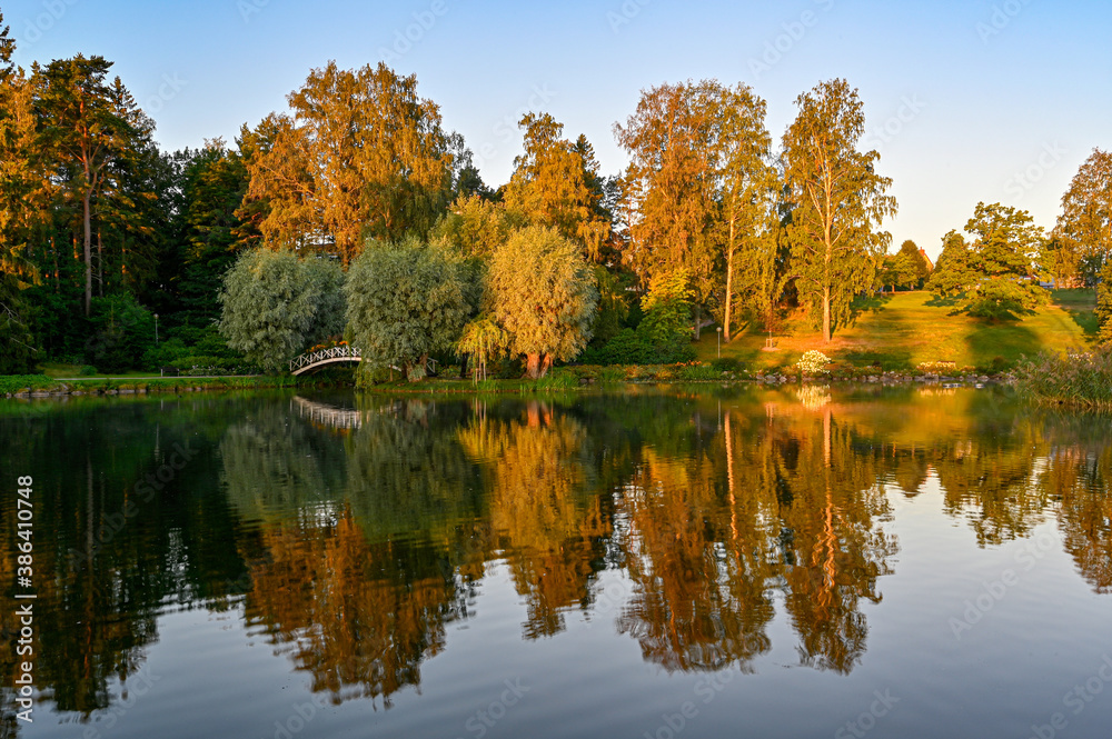morning light over public park and pond in Kumla Sweden morning light over public park and pond in Kumla Sweden