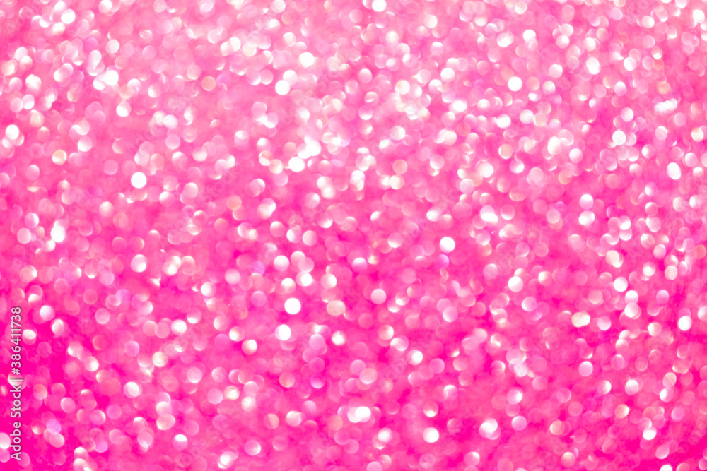 An abstract pink background with sparkle lights and bokeh. Pink blurred light. An abstract pink background with sparkle lights and bokeh. Pink blurred light.