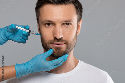 Closeup of middle-aged man getting anti-aging procedure