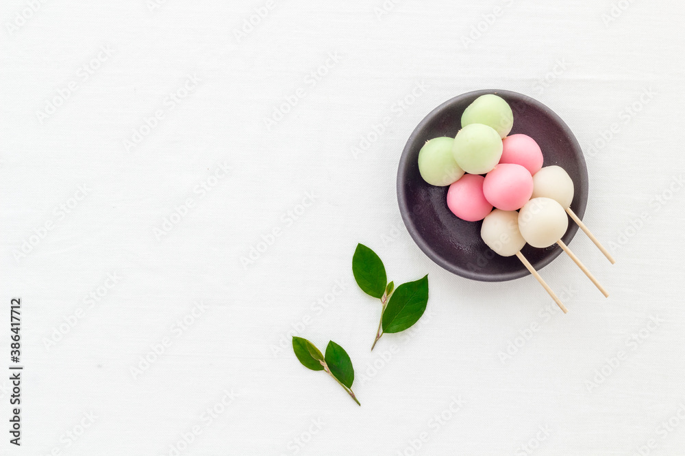 Japanese Dango dessert in pink, white and green colors, copy space Japanese Dango dessert in pink, white and green colors, copy space
