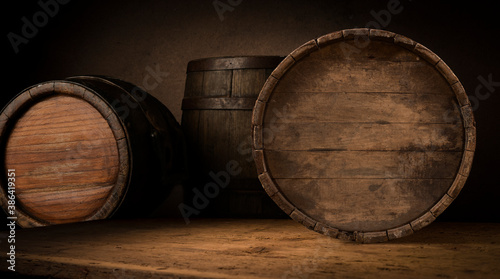 Old wooden barrel on a brown background