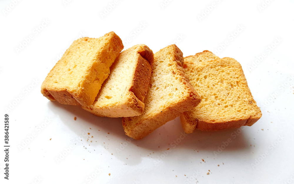 crispy rusk, cake rusk, cardamom rusk, Crunchy or Toast for healthy life, Traditional biscuit tray with tea, toasts for breakfast and cup of fresh milk & Tea, dry toasty bread, crunchy toast, pau, pav
