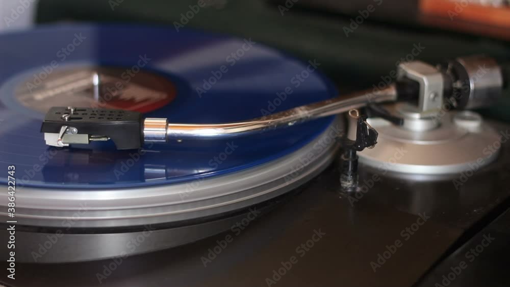 old blue vinyl record with clipping path. DJ Turntable with Vinyl Record, Playing, Top View. Close up at the needle on turntable old blue vinyl record with clipping path. DJ Turntable with Vinyl Record, Playing, Top View. Close up at the needle on turntable