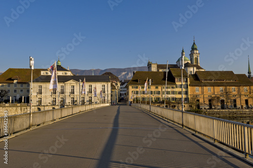 Riverside of Aare and houses dominated by Saint Ursus Cathedral in Solothurn, Switzerland