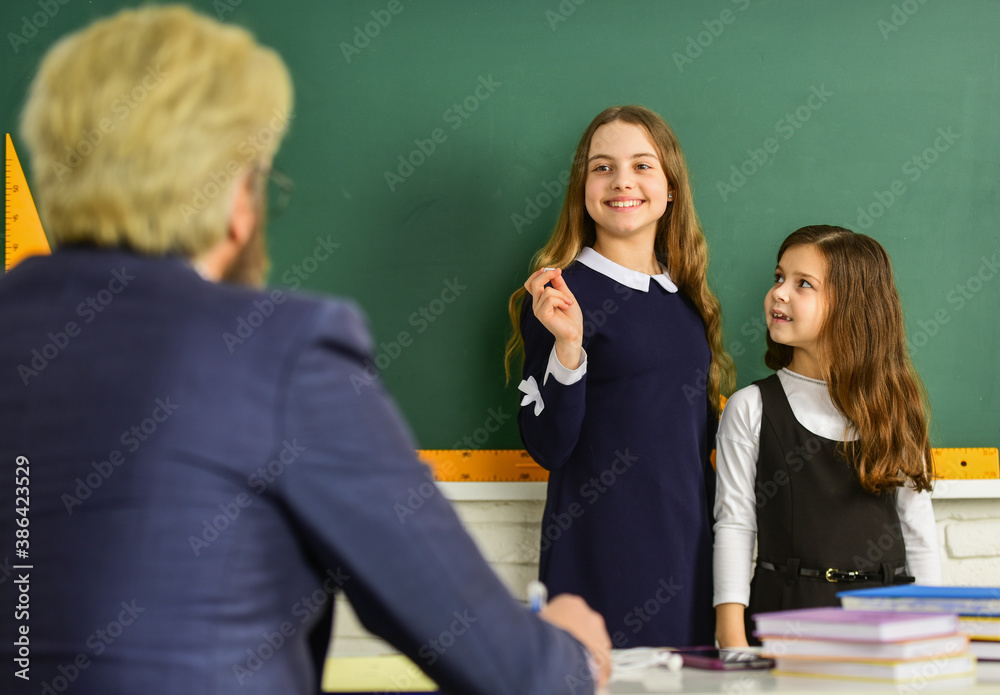 Study together. Back to school. Help and support. Effectively use primary sources. Teacher and kids Classroom. Discussion group of children and teacher. Dialogue and communication. Daily school life