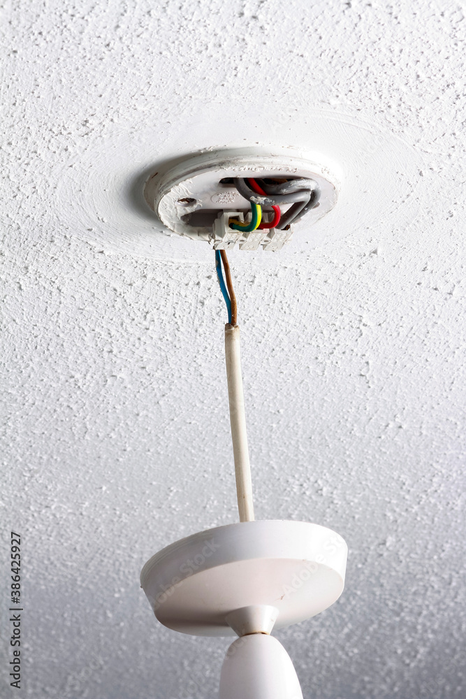 UK pendant light fitting fixed to a textured ceiling showing lighting circuit wiring UK pendant light fitting fixed to a textured ceiling showing lighting circuit wiring