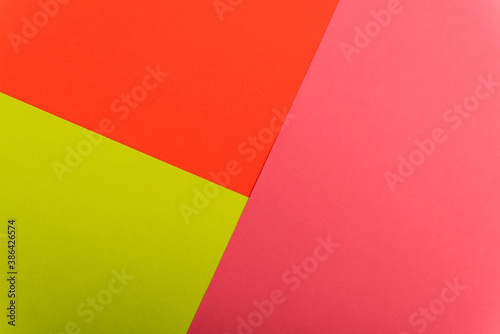 top view of colorful abstract red, green and pink paper background